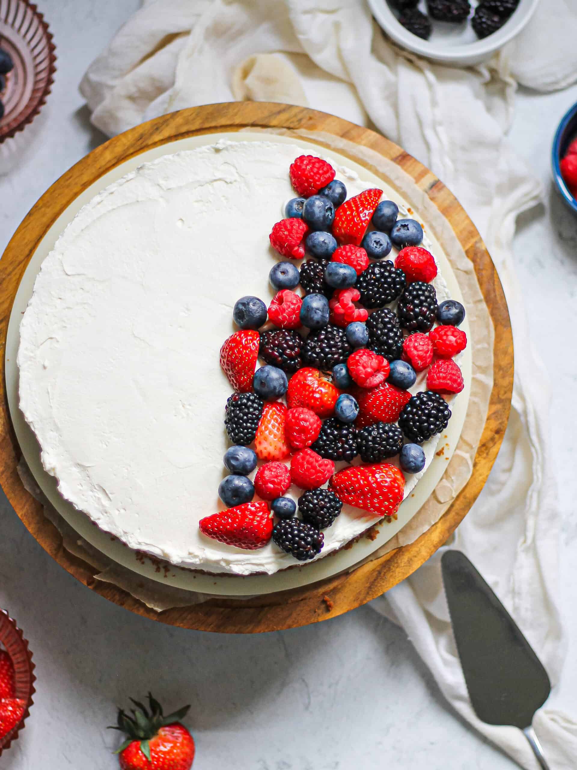 Overhead image of no bake mascarpone cheesecake with berries on top.