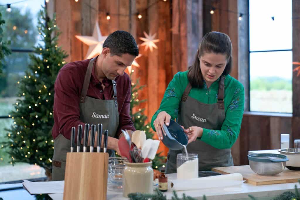 Susan and Saman in the holiday baking barn for Hallmark Channe's Baked with Love: Holiday