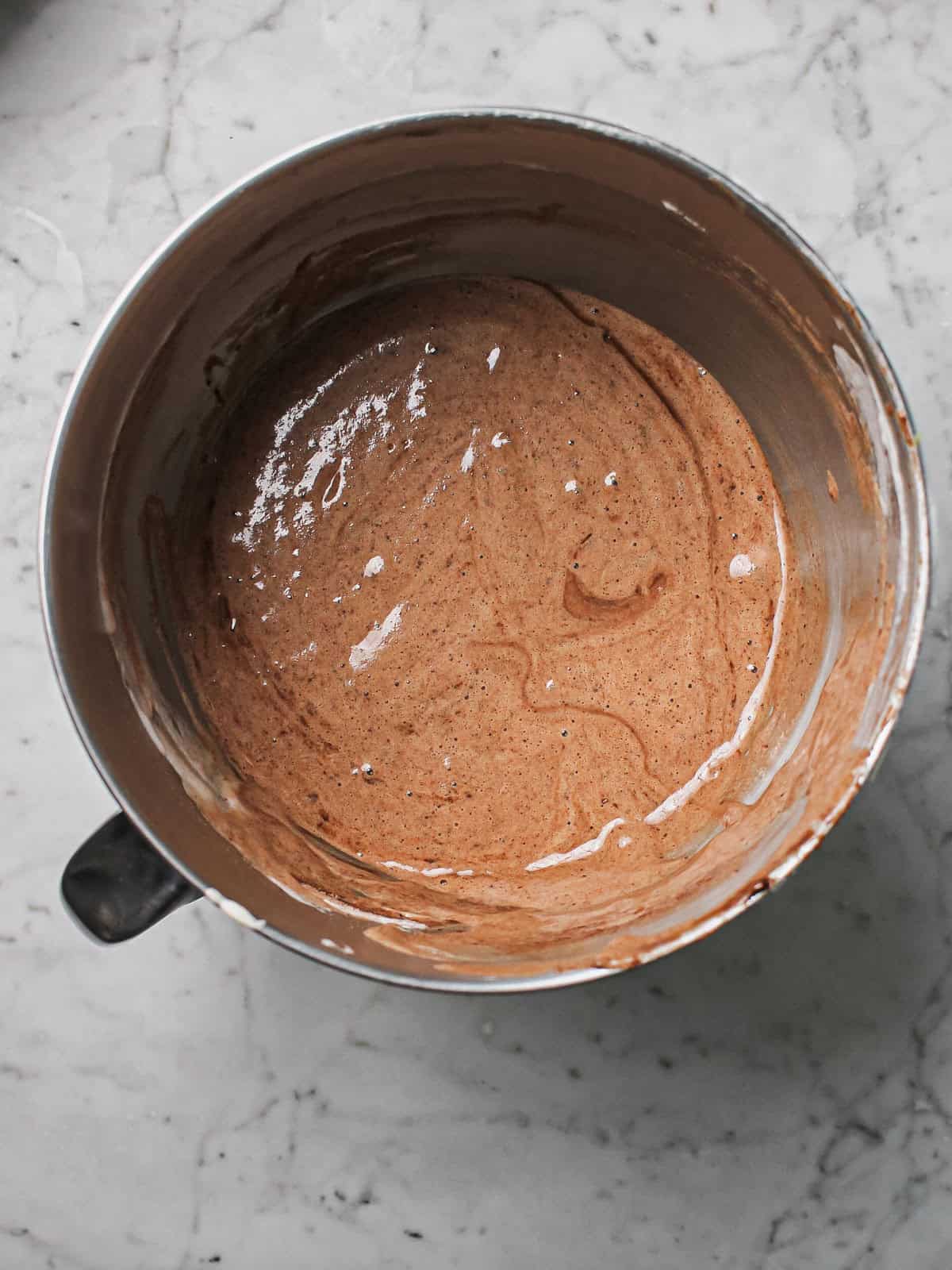 Chocolate sponge batter as eggs are gently folded in.