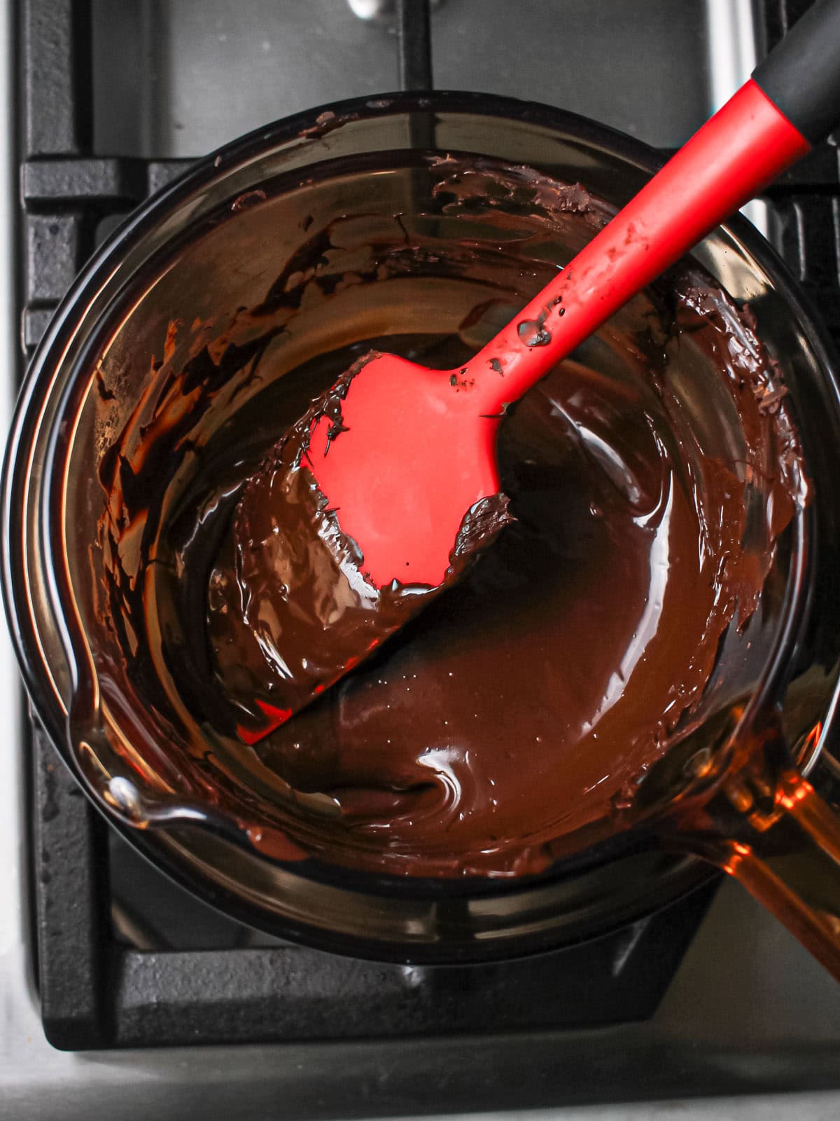 Dark chocolate melted over double boiler for tempering.