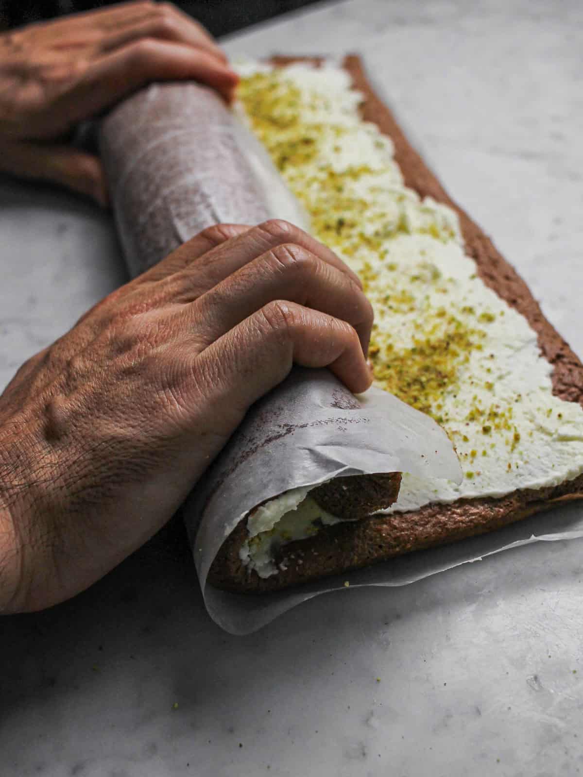 Action shot of rolling our chocolate yule log.