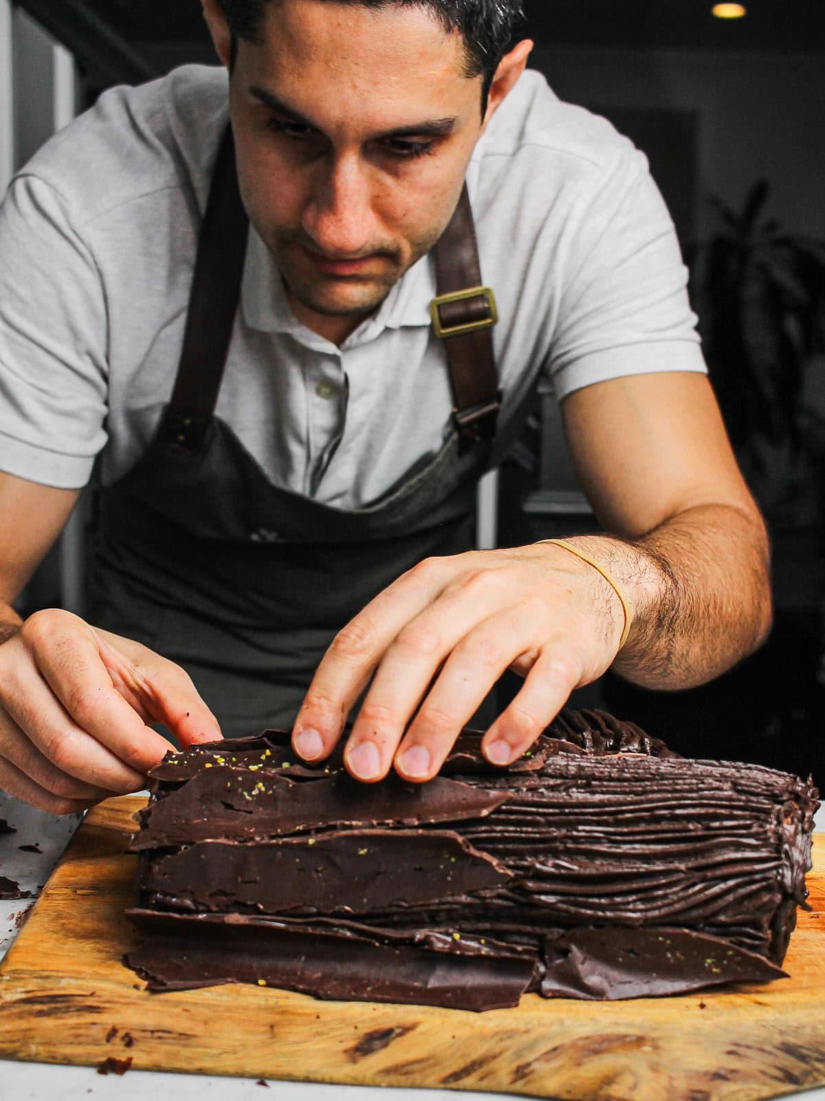 Action shot of Saman decorating our chocolate yule log.