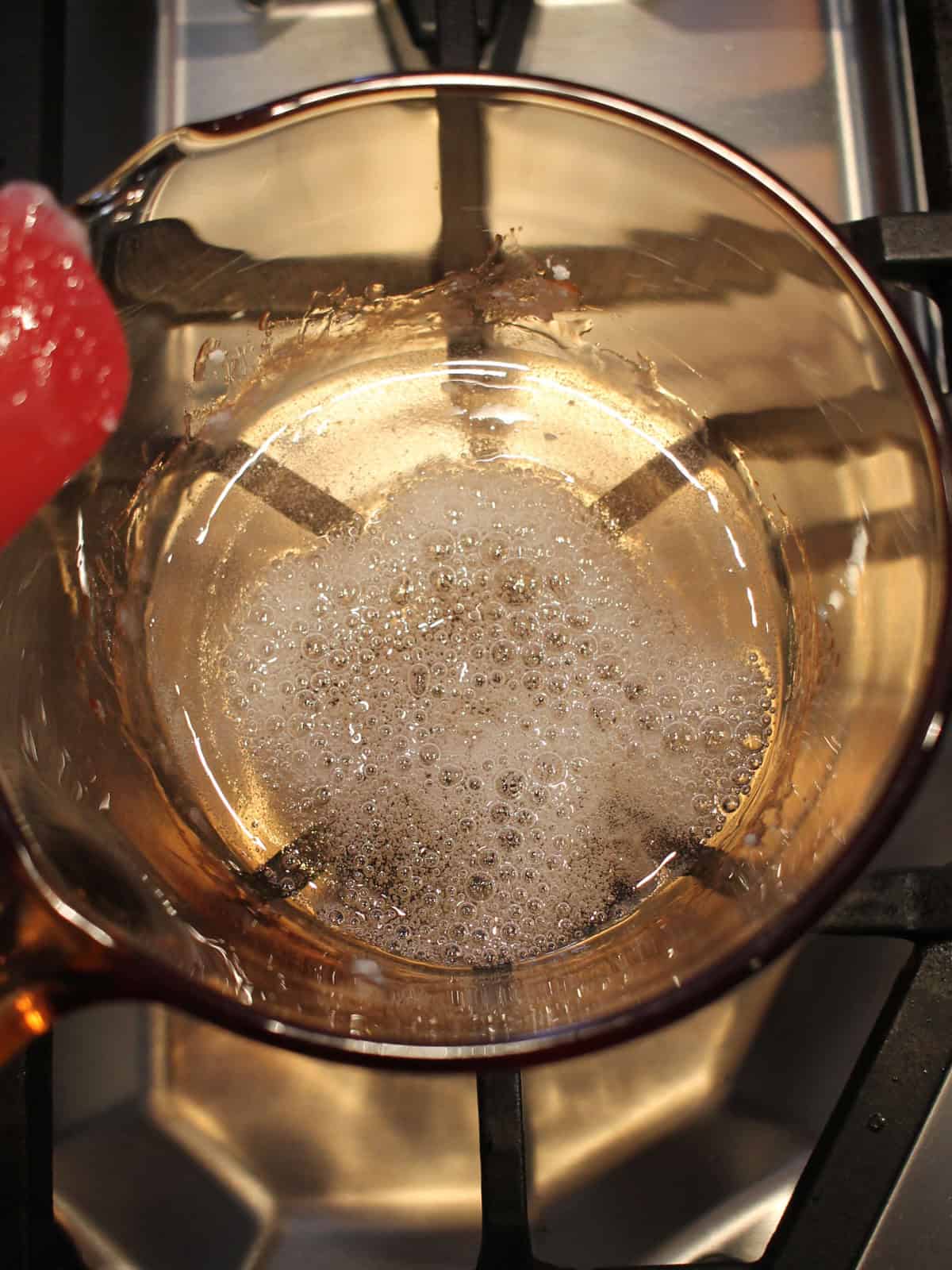 Cooking isomalt over the stovetop.