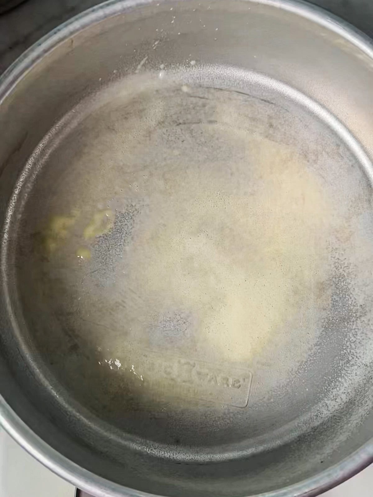 Small cake pan with baking release spray on it.