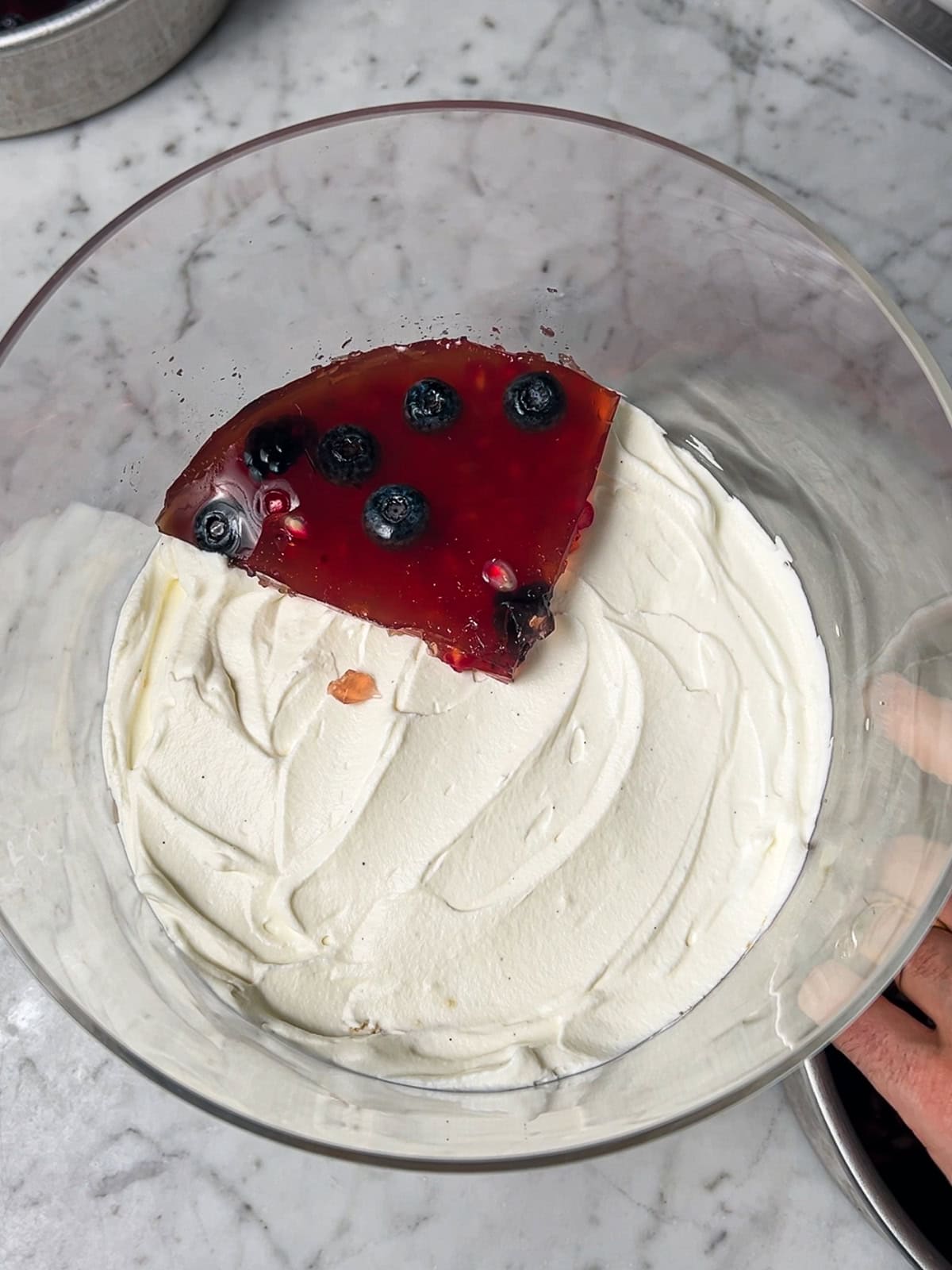 Adding gelatin to trifle dish.