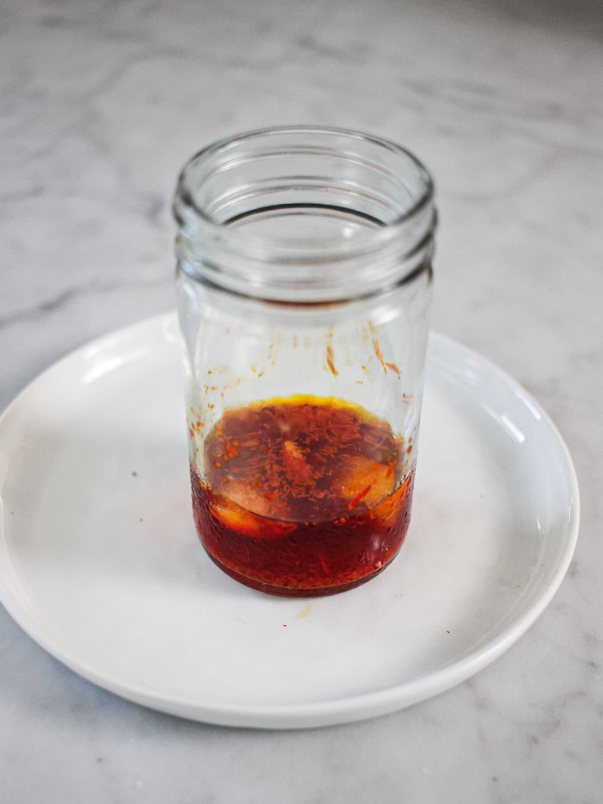 Blooming saffron with ice cubes in a small clear jar.