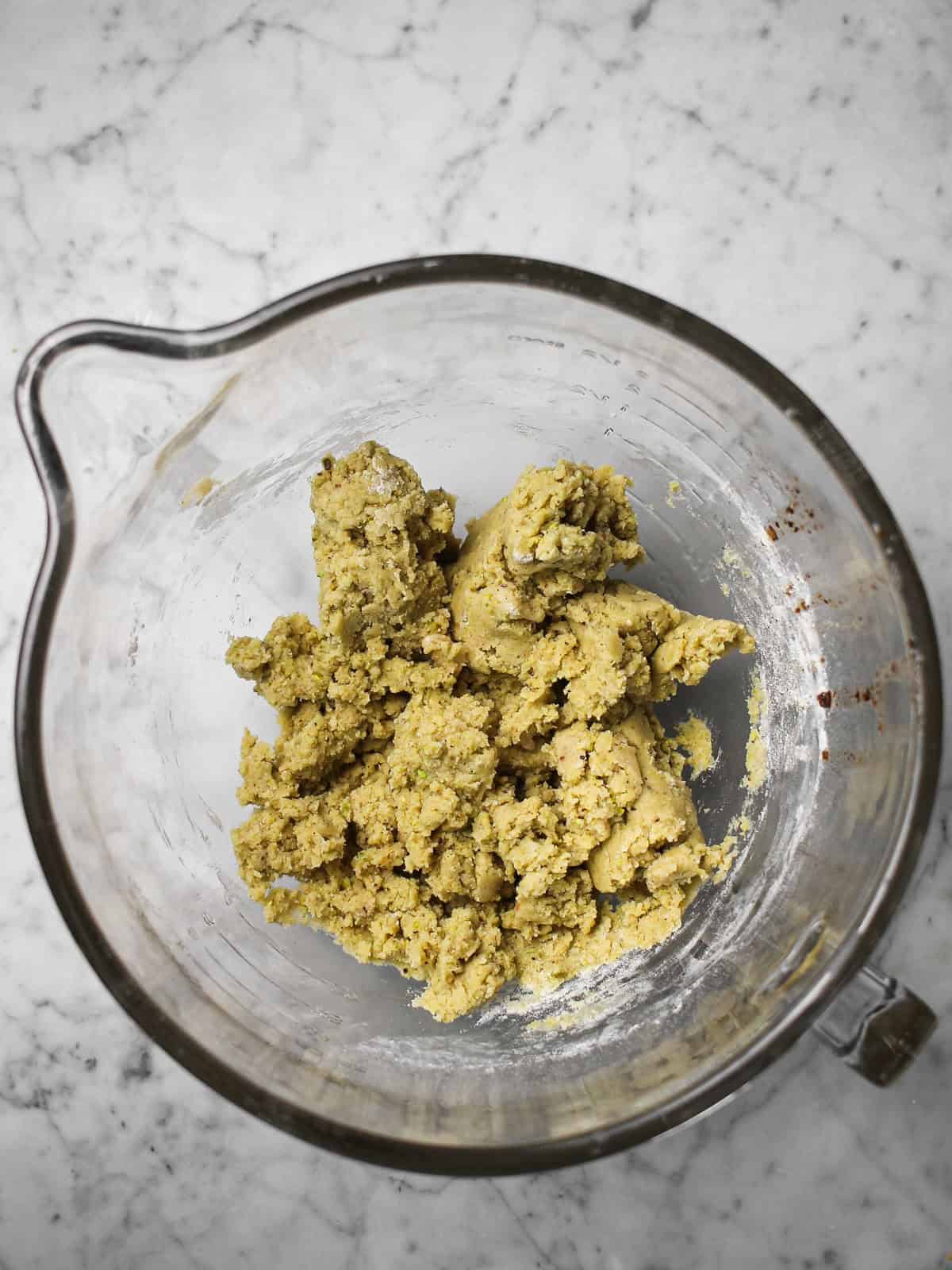 Cookie dough with pistachio meal in it.