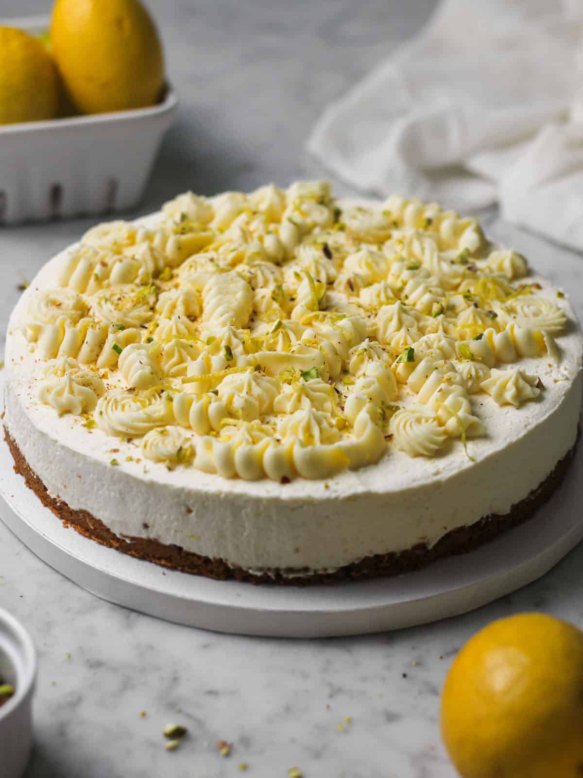 No-bake lemon mascarpone cheesecake topped with whipped white chocolate ganache.