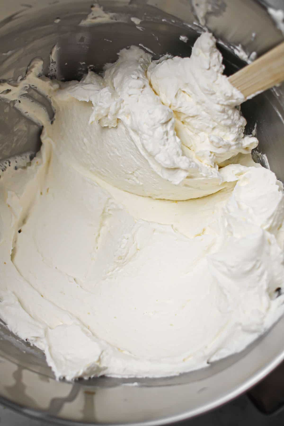 Mascarpone, heavy cream, and powdered sugar in a chilled mixing bowl.