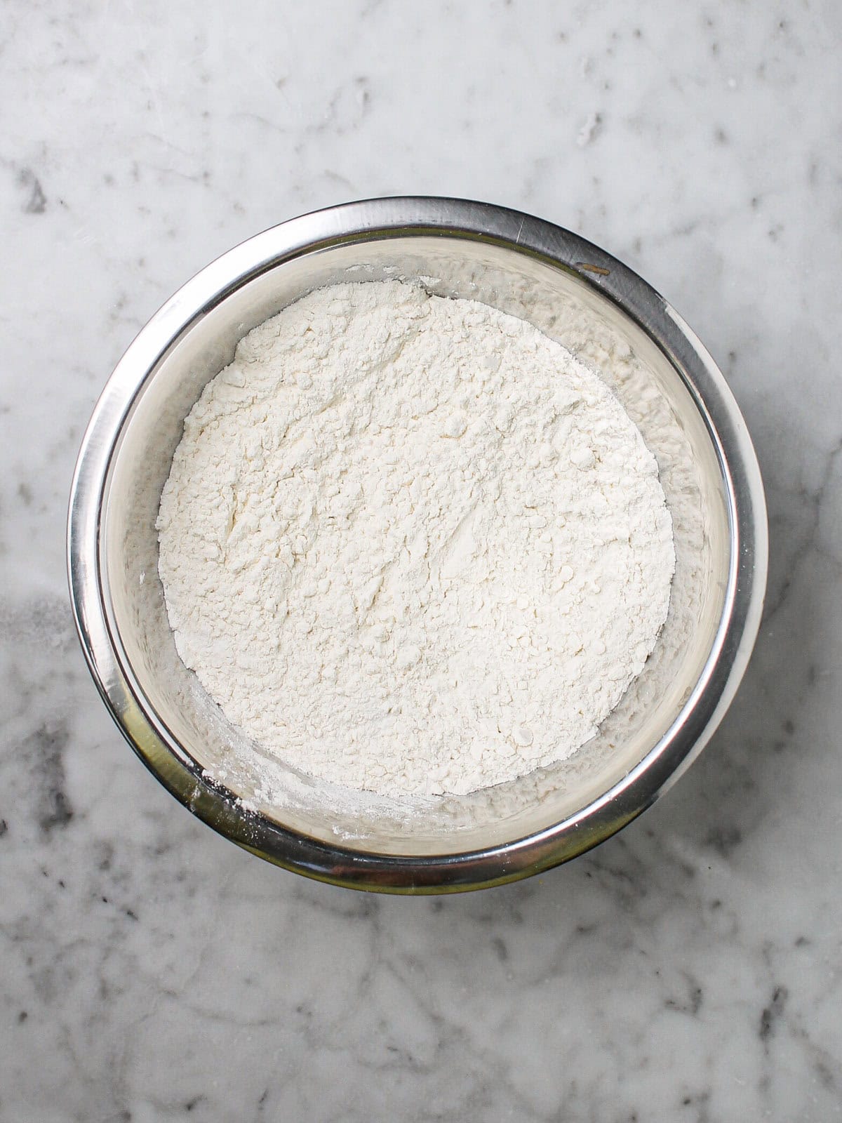 Flour, baking powder, baking soda, and salt whisked together in a medium bowl.
