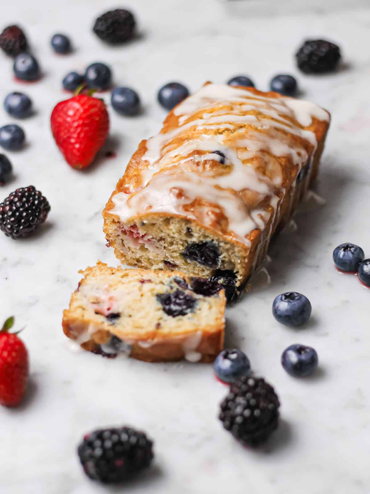 Mini loaf cake, with one small slice cut.