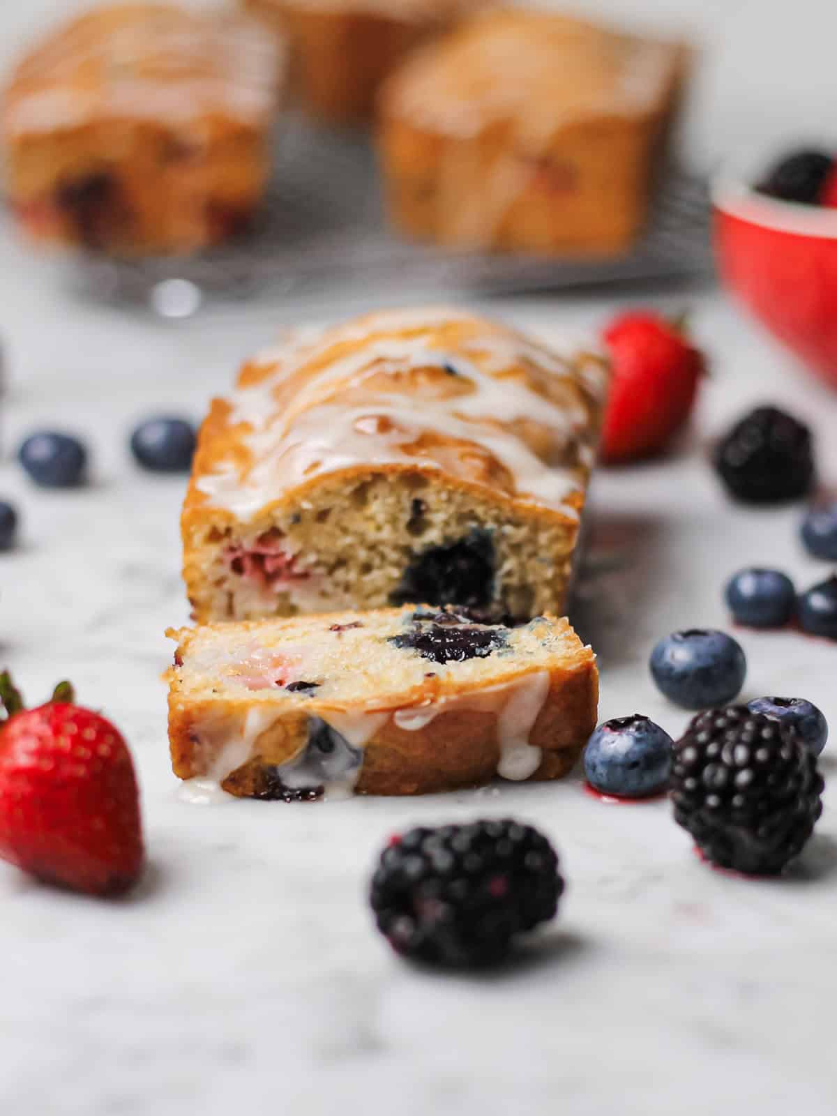Cut mini loaf cake, revealing look at the interior crumb.