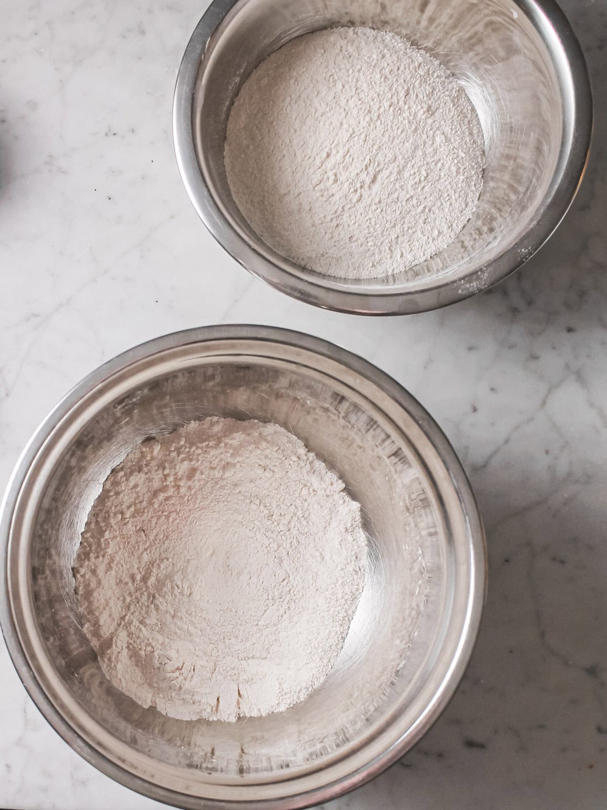 Two bowls of dry ingredients, whisked.