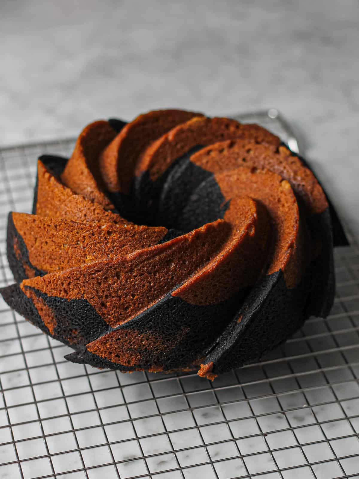 Baked Bundt cake, flipped out of the pan and cooling on a wire rack.